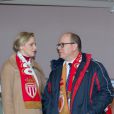  La princesse Charlene et le prince Albert II de Monaco lors du choc ASM - PSG au Stade Louis II le 9 février 2014 