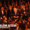 Niels Arestrup, qui s'accroche dans les cheveux d'une dame, est le lauréat du César du meilleur second rôle dans Quai d'Orsay de Bertrand Tavernier, le 28 février 2014 à Paris