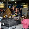 Micha et Kim de retour à Paris après le tournage de l'émission 'Les Marseillais a Rio' pour W9, le 6 mars 2014, à l'aéroport Roissy Charles de Gaulle.