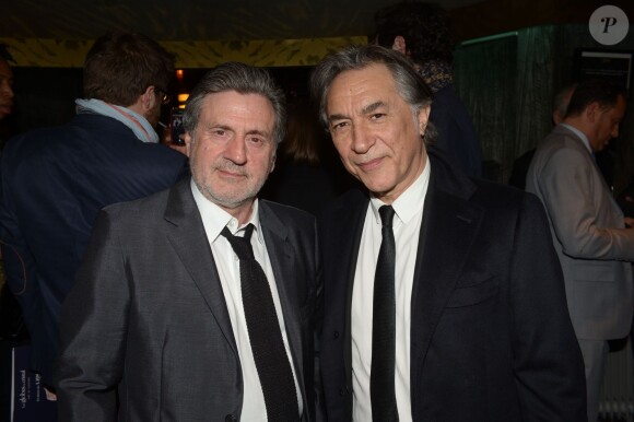Exclusif - Daniel Auteuil et Richard Berry lors de la 9e cérémonie des Globes de Cristal au Lido à Paris, le 10 mars 2014.