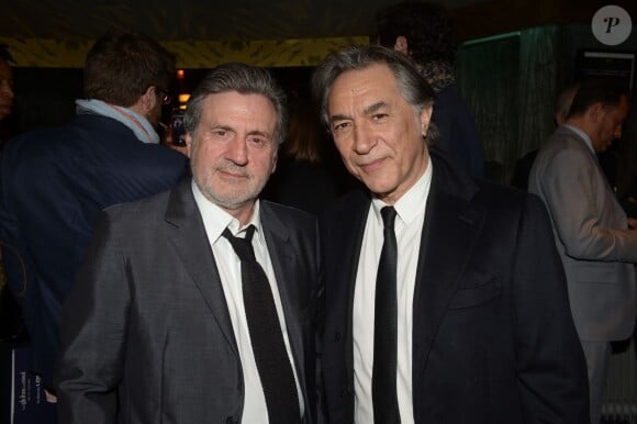 Exclusif - Daniel Auteuil et Richard Berry lors de la 9e cérémonie des Globes de Cristal au Lido à Paris, le 10 mars 2014.