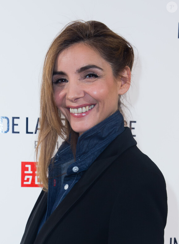 Clotilde Courau fête le lancement de la collection Inès de la Fressange Paris pour Uniqlo dans la boutique de la marque, à Opéra. Paris, le 12 mars 2014.