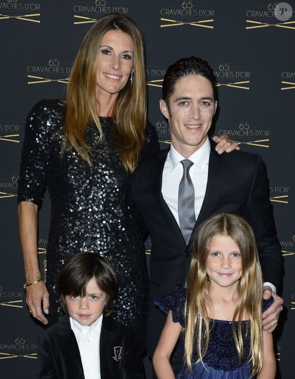 Sophie Thalmann, son mari Christophe Soumillon en compagnie de leurs enfants Charlie et Mika lors de la 65ème édition des Cravaches d'Or au Théâtre des Champs-Elysées à Paris, le 14 mars 2014.