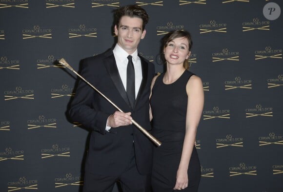 Jonathan Plouganou et sa femme lors de la 65ème édition des Cravaches d'Or au Théâtre des Champs-Elysées à Paris, le 14 mars 2014.