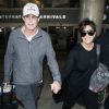 Bruce et Kris Jenner, main dans la main à leur arrivée à l'aéroport de Los Angeles. Le 2 avril 2014.