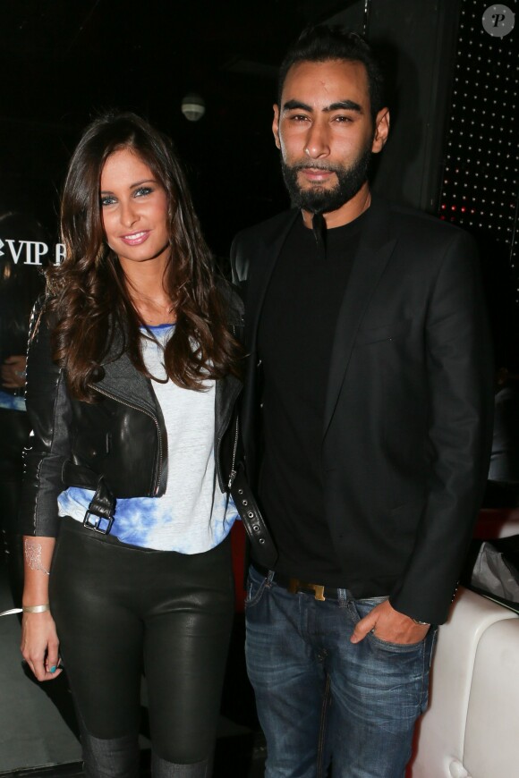 Malika Ménard et le rappeur La Fouine à la soirée de lancement de la marque "Wingista" de Marion Bartoli au VIP Room à Paris, le 9 avril 2014. L'ex tennis woman s'est lancée dans la création d'accessoires pour chaussures, une collection d'ailes baptisée Wingista.