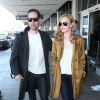 Kate Bosworth arrive à l'aéroport de Los Angeles avec son mari Michael Polish, superbement vêtue et chaussée de bottines Rodarte (collection printemps-été 2014). Le 11 avril 2014.