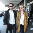  Kate Bosworth arrive &agrave; l'a&eacute;roport de Los Angeles avec son mari Michael Polish, superbement v&ecirc;tue et chauss&eacute;e de bottines Rodarte (collection printemps-&eacute;t&eacute; 2014). Le 11 avril 2014. 