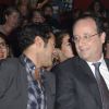 Jamel Debbouze et François Hollande dans le public lors de la finale du 4e Trophée d'Impro de la Fondation Culture et Diversité et de la Compagnie Déclic Théâtre, le 19 mai 2014 au Théâtre Comedia, à Paris.