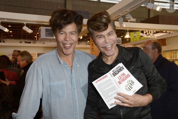 Igor et Grichka Bogdanoff lors de la 34e édition du Salon du livre à la Porte de Versailles à Paris le 23 mars 2014