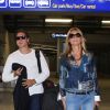 Heidi Klum, lunettes sur le nez, et son nouveau compagnon Vito Schnabel arrivent à l'aéroport Nice pour assister au 67e festival de Cannes le 21 mai 2014.