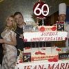 Exclusif - Jean-Marie Bigard et sa femme Lola découpent le gâteau - Jean-Marie Bigard fête ses 60 ans au Grand Rex à Paris le 23 mai 2014.
