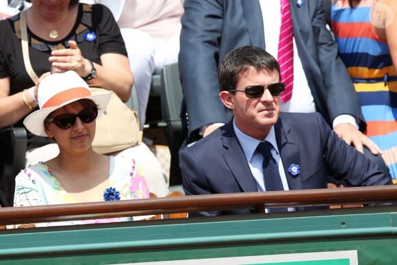 Najat Vallaud-Belkacem et Manuel Valls lors de la finale homme des Internationaux de France de tennis de Roland-Garros à Paris, le 8 juin 2014.
