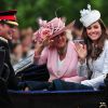 Kate Middleton, duchesse de Cambridge, Camilla Parker Bowles, duchesse de Cornouailles, et le prince Harry descendant le Mall en landau lors de la parade Trooping the Colour marquant le 14 juin 2014 la célébration solennelle des 88 ans de la souveraine.