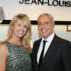 Lynda Lacoste et son compagnon Bruno Bensoussan à l'inauguration de la nouvelle boutique Jean-Louis Scherrer au 111, rue du faubourg Saint-Honoré à Paris, le 19 juin 2014.