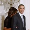 Barack Obama et son épouse Michelle lors d'une cérémonie en l'honneur des médaillés olympiques de Sotchi, le 3 avril 2014 à la Maison Blanche à Washington