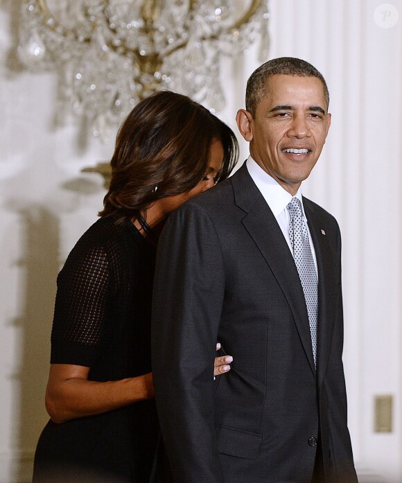 Barack Obama et son épouse Michelle lors d'une cérémonie en l'honneur des médaillés olympiques de Sotchi, le 3 avril 2014 à la Maison Blanche à Washington