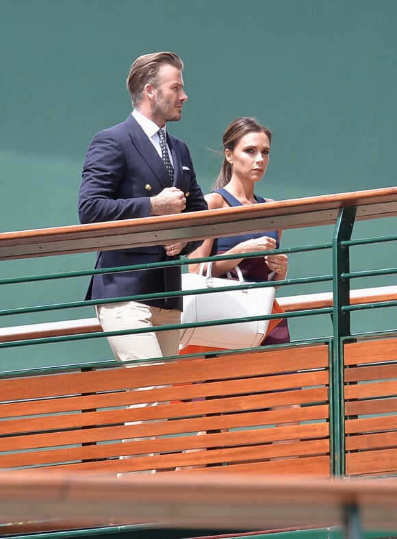 David et Victoria Beckham arrivent à Wimbledon pour assister à la finale homme entre Roger Federer et Novak Djokovic, le 6 juillet 2014.