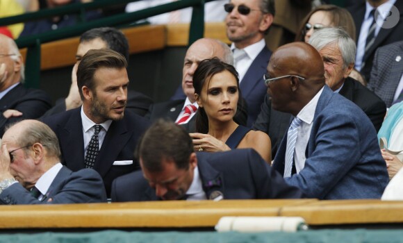 David et Victoria Beckham ainsi que Samuel L. Jackson assistent à la finale homme, à Wimbledon,  entre Roger Federer et Novak Djokovic, le 6 juillet 2014.