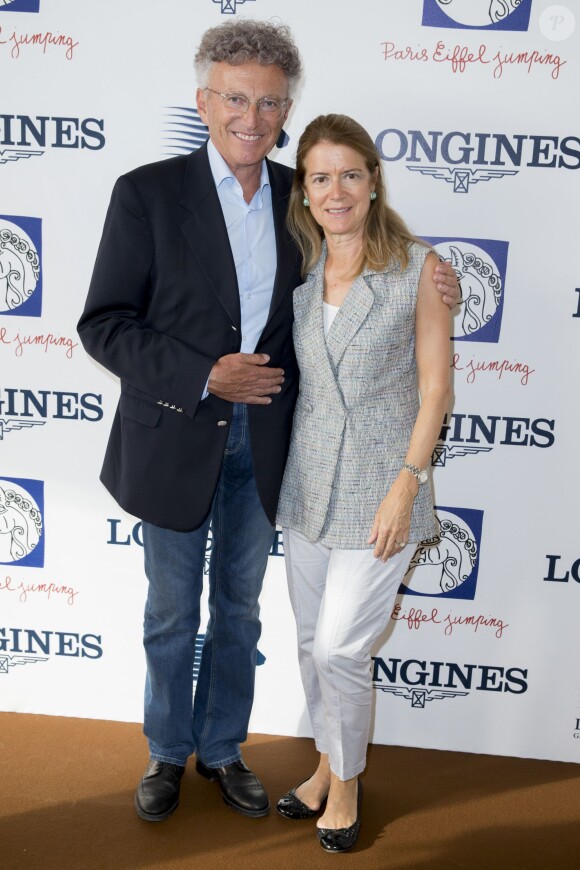 Exclusif - Nelson Monfort et sa femme Dominique - Deuxième jour du Paris Eiffel Jumping présenté par Gucci, septième étape du Longines Global Champions Tour, à Paris le 5 juillet 2014.