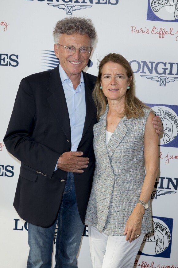 Exclusif - Nelson Monfort et sa femme Dominique - Deuxième jour du Paris Eiffel Jumping présenté par Gucci, septième étape du Longines Global Champions Tour, à Paris le 5 juillet 2014.