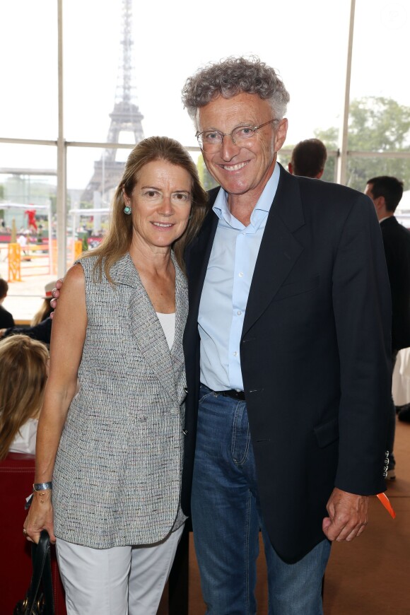 Exclusif - Nelson Monfort et sa femme Dominique - Deuxième jour du Paris Eiffel Jumping présenté par Gucci, septième étape du Longines Global Champions Tour, à Paris le 5 juillet 2014.