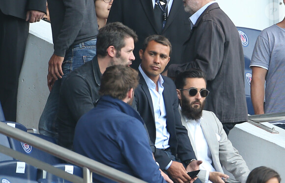 Jalil Lespert et Brahim Asloum assistent au match PSG-Bastia pour la 2ème journée 2014/2015 au Parc des Princes le 16 août 2014 à Paris.