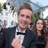 Philippe Lacheau (portant une montre Montblanc TimeWalker) et Alice David - Montée des marches du film "Dragon 2" lors du 67e Festival du film de Cannes le 16 mai 2014