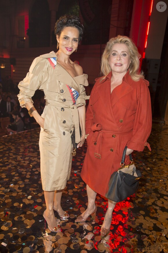 Farida Khelfa et Catherine Deneuve - Arrivées au dernier défilé de mode "Jean-Paul Gaultier", collection prêt-à-porter printemps-été 2015, au Grand Rex à Paris. Le 27 septembre 2014