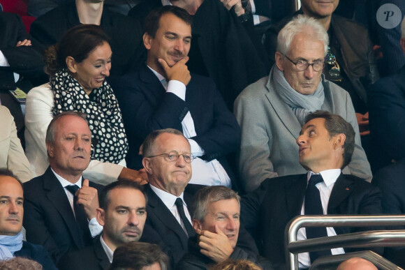 Bernard Lacombe, Jean-Michel Aulas et Nicolas Sarkozy lors du match entre le PSG et Lyon au Parc des Princes à Paris le 21 septembre 2014