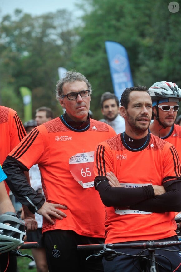 Laurent Blanc et Michaël Llodra - La troisième édition de la "Run & Bike Solidaire" au profit du Secours populaire français organisée à Paris sur le Domaine national de Saint-Cloud, le 12 octobre 2014.