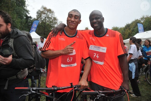 Jimmy Vicaut et Lilian Thuram - La troisième édition de la "Run & Bike Solidaire" au profit du Secours populaire français organisée à Paris sur le Domaine national de Saint-Cloud, le 12 octobre 2014.