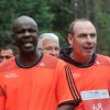 Lilian Thuram et Alain Boghossian - La troisième édition de la "Run & Bike Solidaire" au profit du Secours populaire français organisée à Paris sur le Domaine national de Saint-Cloud, le 12 octobre 2014.