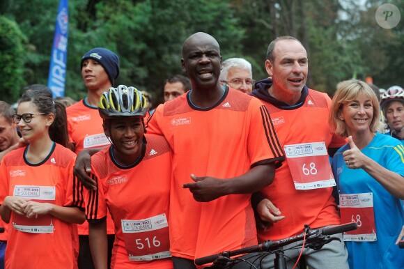Lilian Thuram et Alain Boghossian - La troisième édition de la "Run & Bike Solidaire" au profit du Secours populaire français organisée à Paris sur le Domaine national de Saint-Cloud, le 12 octobre 2014.