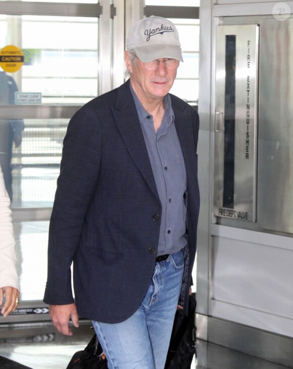 Richard Gere arrive à l'aéroport de Washington, le 23 septembre 2014.