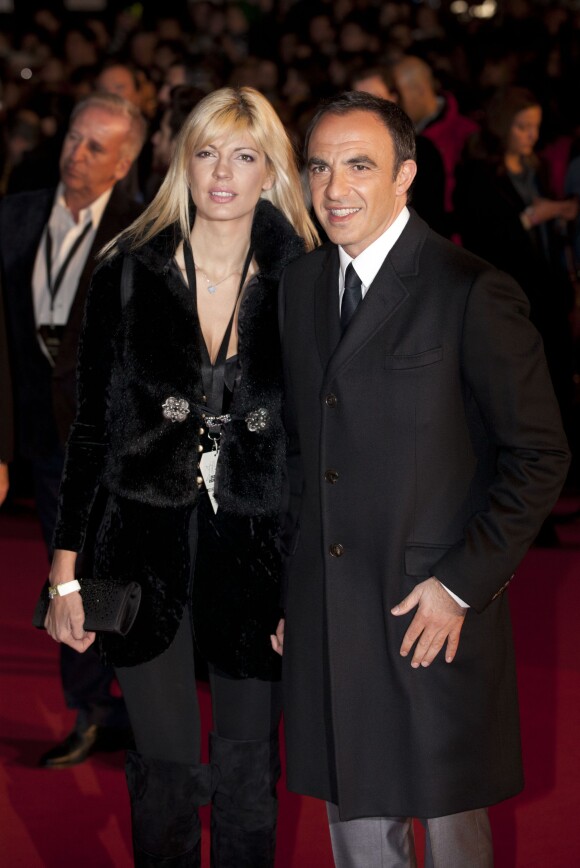 L'animateur Nikos Aliagas et sa compagne Tina Grigouriou - 15e édition des NRJ Music Awards à Cannes. Le 14 décembre 2013.