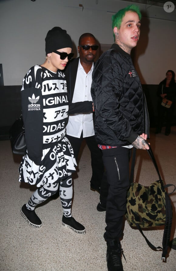 Rita Ora et son petit ami Ricky Hil (Richard Hilfiger) à l'aéroport de Los Angeles, le 11 octobre 2014.