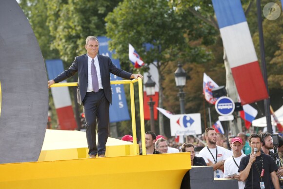 Bernard Hinault à l'arrivée de la dernière étape du 101ème Tour de France sur l'avenue des Champs-Elysées à Paris, le 27 juillet 2014