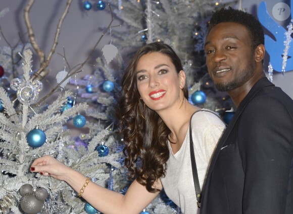 Corneille et sa femme assistent au lancement des festivités de Noël à Disneyland Paris, à Marne-la-Vallée, le samedi 15 novembre 2014.