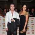Simon Cowell et sa fiancée Lauren Silverman lors de la soirée de remise des prix "Pride of Britain Awards 2014" à Londres, le 6 octobre 2014. Le couple est devenu parent d'un petit Eric né le 14 février 2014.