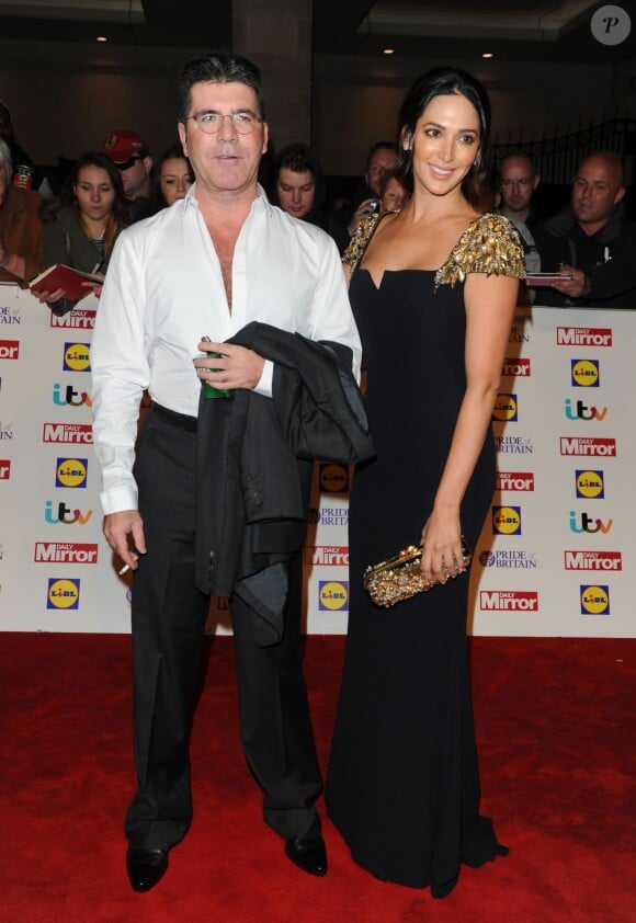Simon Cowell et sa fiancée Lauren Silverman lors de la soirée de remise des prix "Pride of Britain Awards 2014" à Londres, le 6 octobre 2014. Le couple est devenu parent d'un petit Eric né le 14 février 2014.