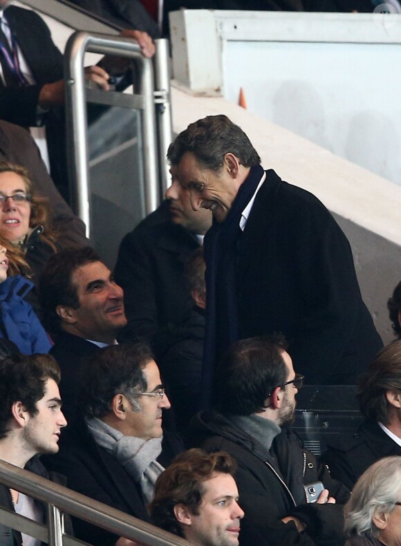 Nicolas Sarkozy lors du match de Ligue des Champions entre le PSG et l'Ajax d'Amsterdam au Parc des Princes à Paris le 25 novembre 2014