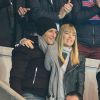 Nagui et son épouse Mélanie Page lors du match de Ligue des Champions entre le PSG et l'Ajax d'Amsterdam au Parc des Princes à Paris le 25 novembre 2014