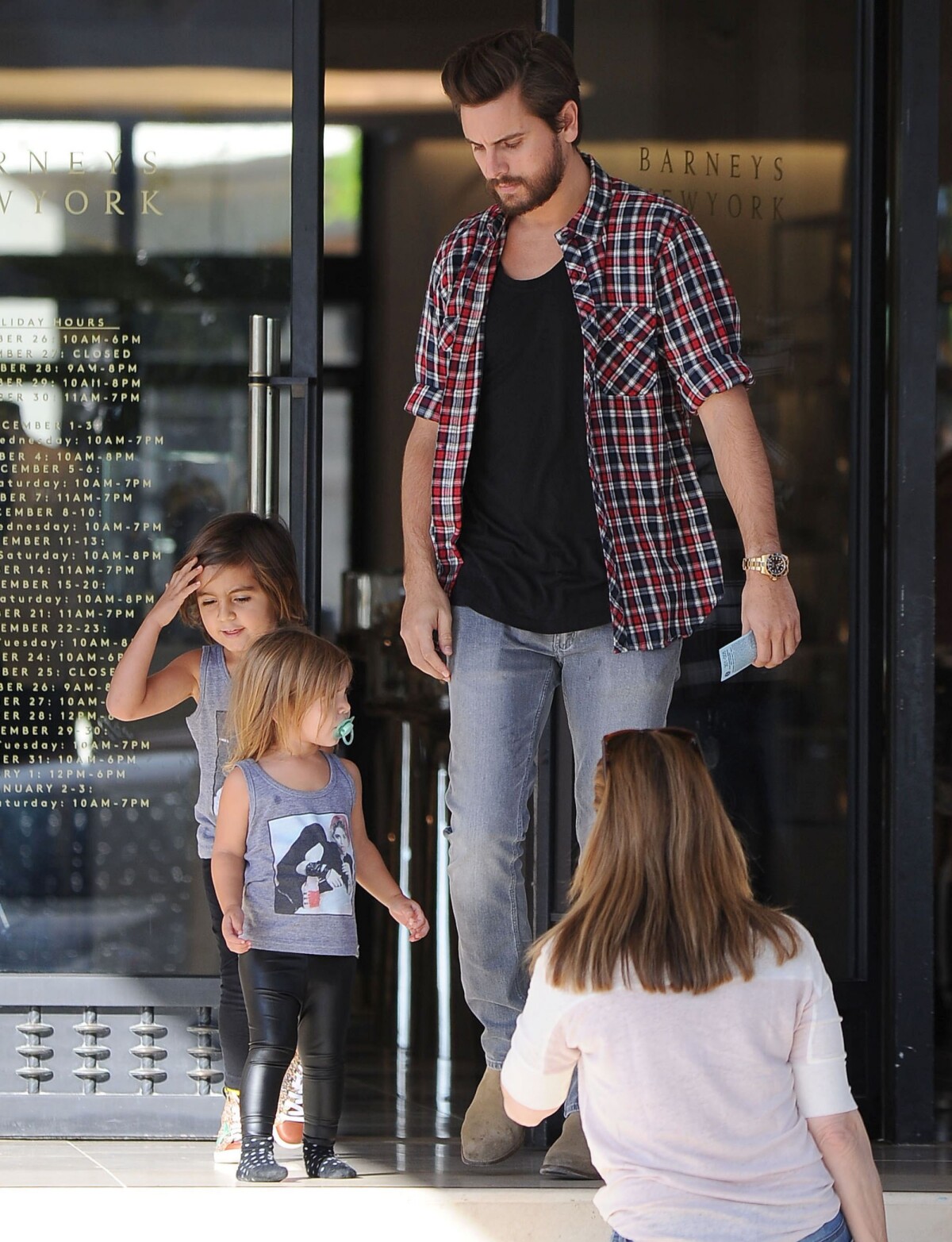 Kourtney Kardashian, Scott Disick and their son Mason at Barney's