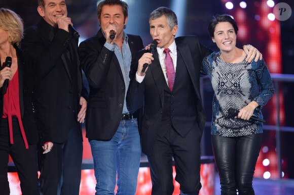 Jerome Anthony, Nagui et Alessandra Sublet lors du 28e Téléthon, le 6 décembre 2014 à Paris face à la Tour Eiffel.