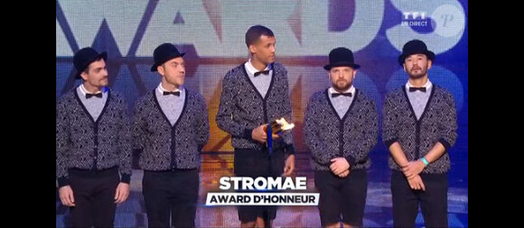 Stromae reçoit un trophée d'honneur lors de la soirée des NRJ Music Awards 2014, à Cannes, le samedi 13 décembre 2014 sur TF1.