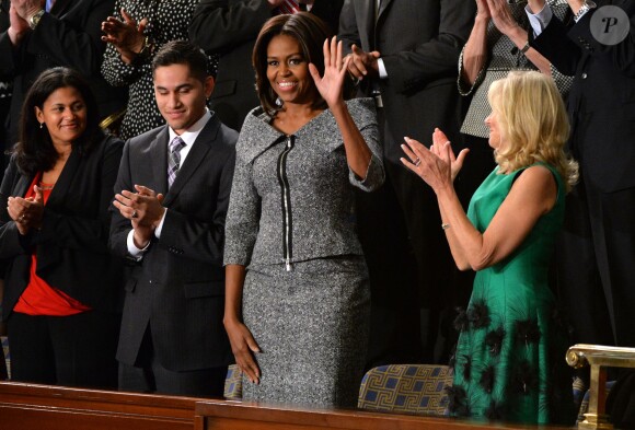 Michelle Obama écoute son mari Barack Obama lors de son discours sur l'état de l'Union, à Washington, le 20 janvier 2015