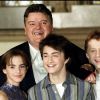 Robbie Coltrane, Emma Watson, Daniel Radcliffe et Rupert Grint lors du photocall de Harry Potter et la chambre des secrets à Londres le 28 octobre 2002