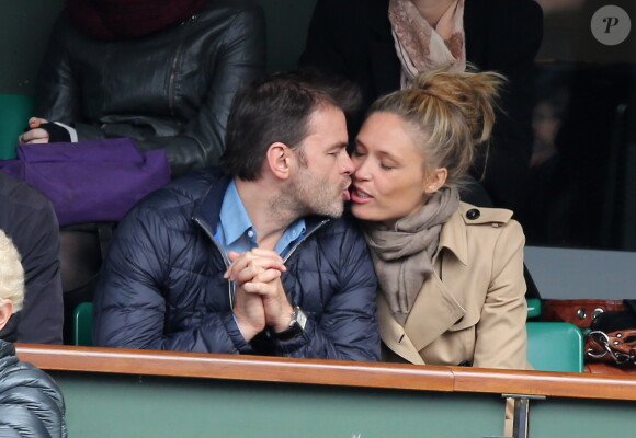 Clovis Cornillac et sa femme Lilou Fogli assistent aux Internationaux de France de tennis de Roland-Garros à Paris, le 27 mai 2014.