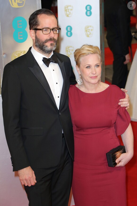 Patricia Arquette et Eric White lors des BAFTA awards à Londres au Ryan albert Hall le 8 février 2015